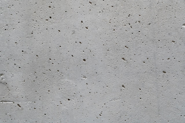 a-cement-wall-with-small-holes-in-it